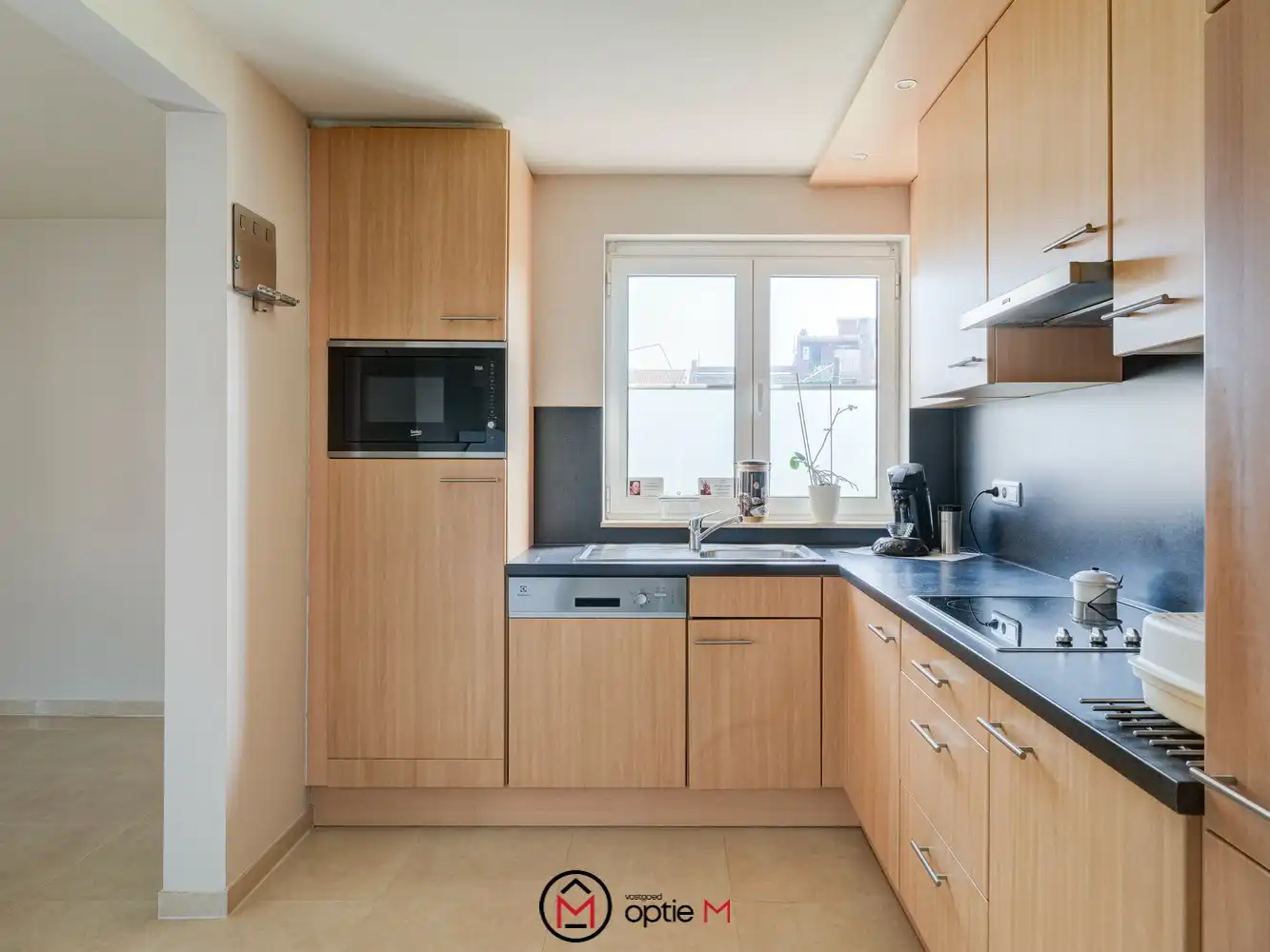 Gelijkvloers appartement te koop in Bilzen – Ruim wonen met terras, carport en kelderberging foto 11
