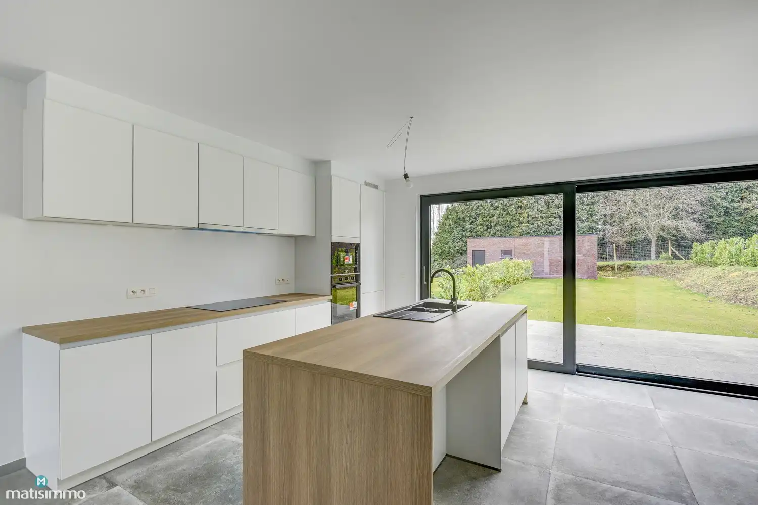 VOLLEDIG AFGEWERKTE EN GESCHILDERDE NIEUWBOUWWONING (EPB E10) MET 3 SLAAPKAMERS, 2 BADKAMERS, 2 GARAGES, KELDER EN AANGELEGDE TUIN IN WERM foto 10