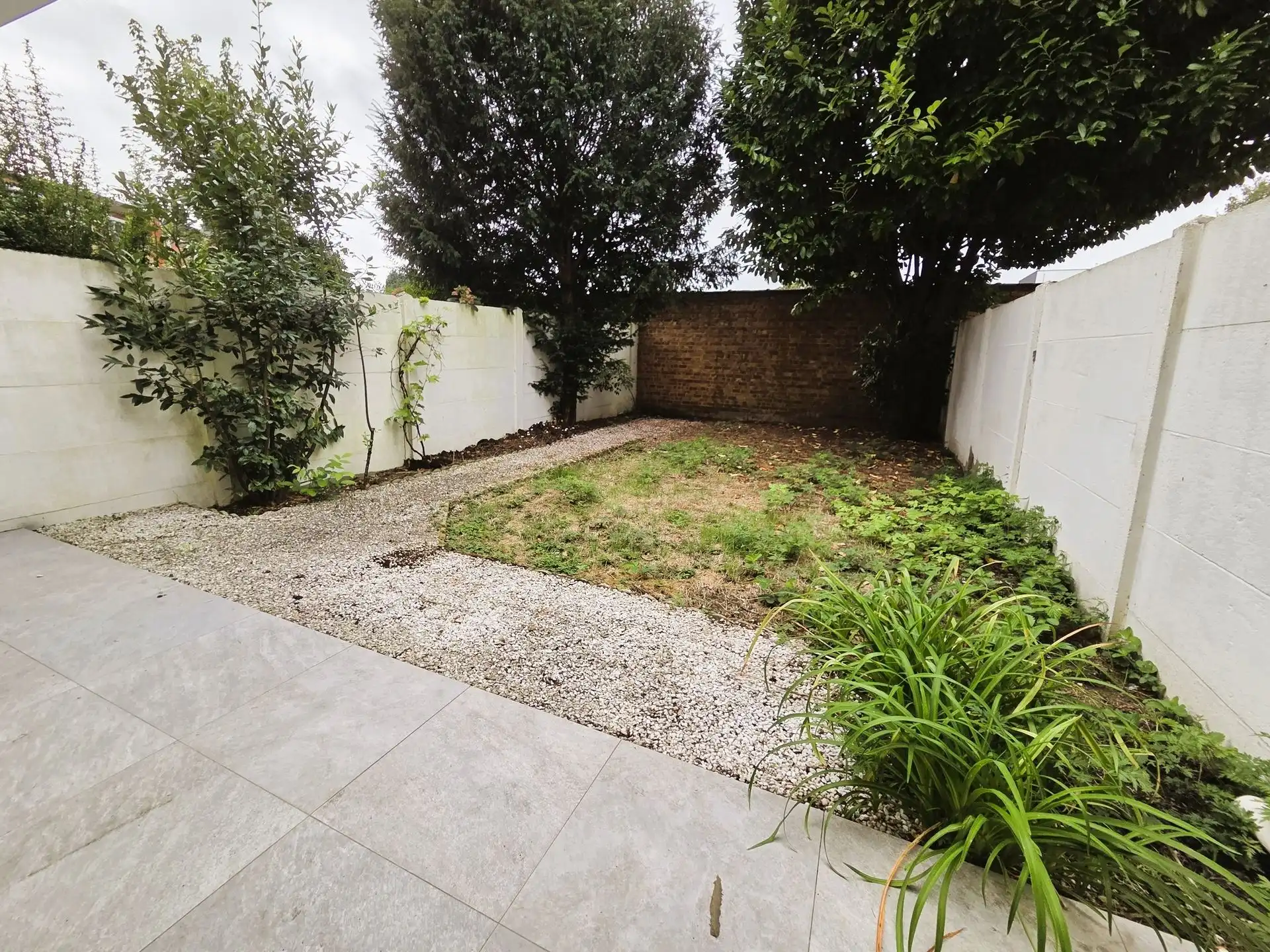 Instapklaar gelijkvloers appartement met zonnige tuin foto 2