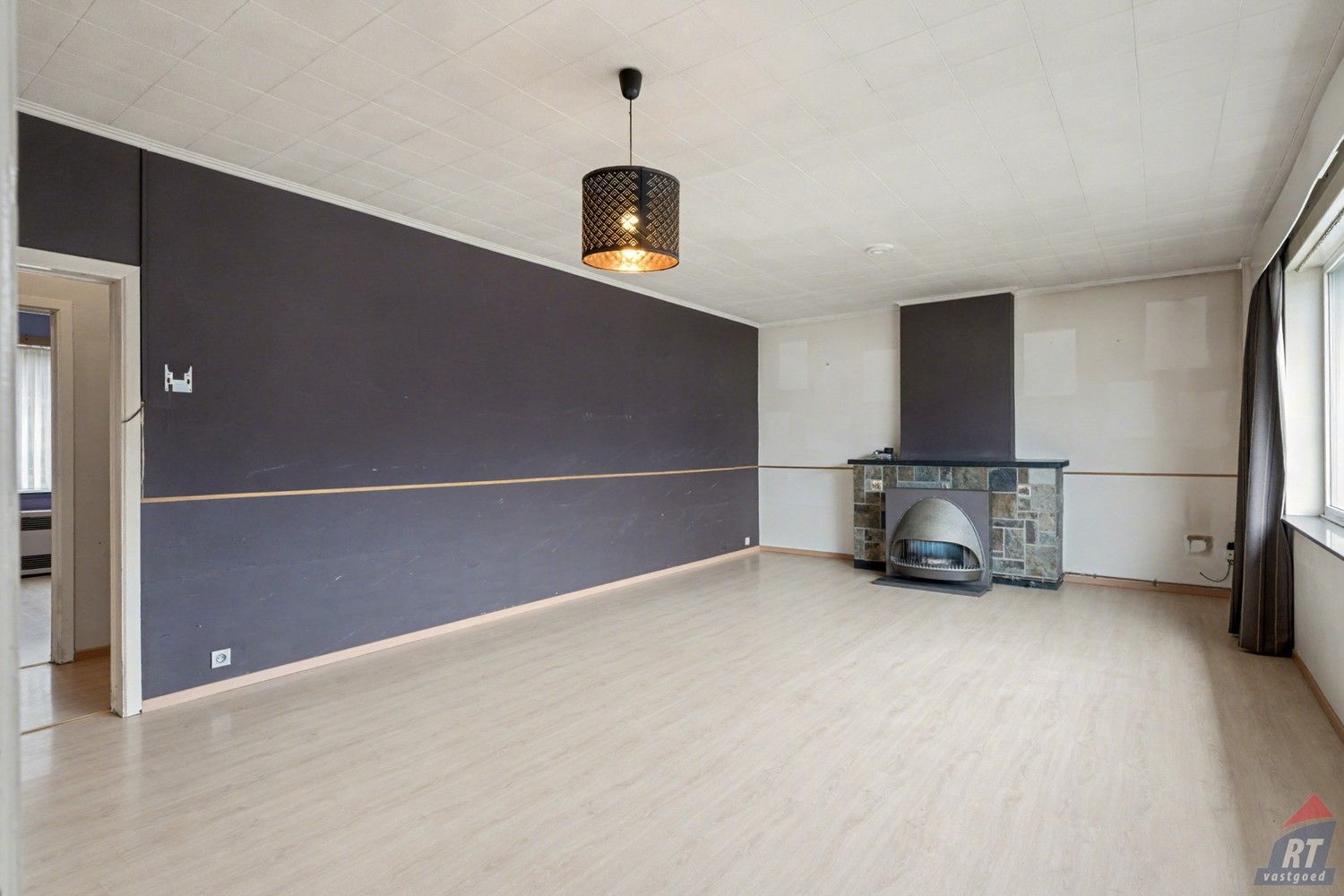 Gelijkvloerse halfopen woning met tuin en renovatiepotentieel in het hart van Sint-Truiden foto 3