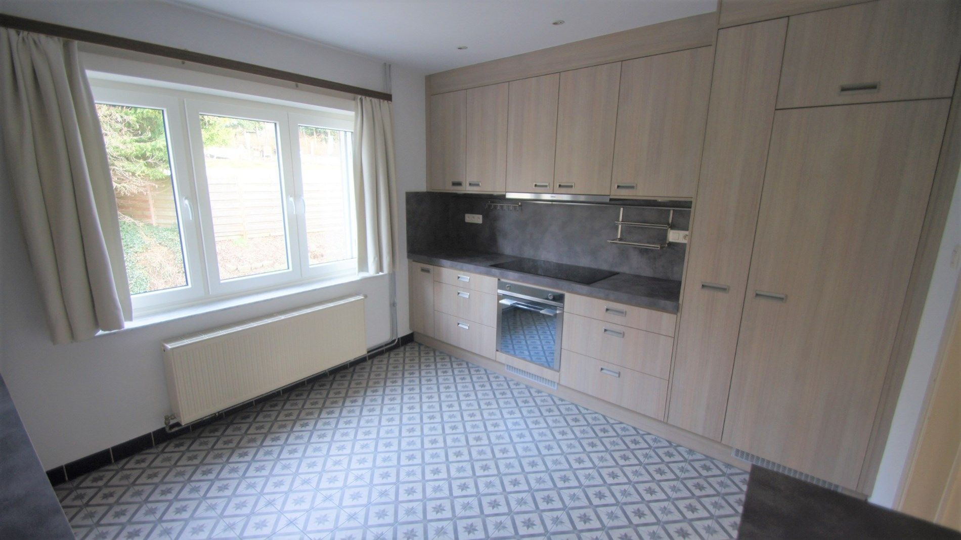 Mooi gelegen woning met tuin/terras, 2 slpks en garage foto 5