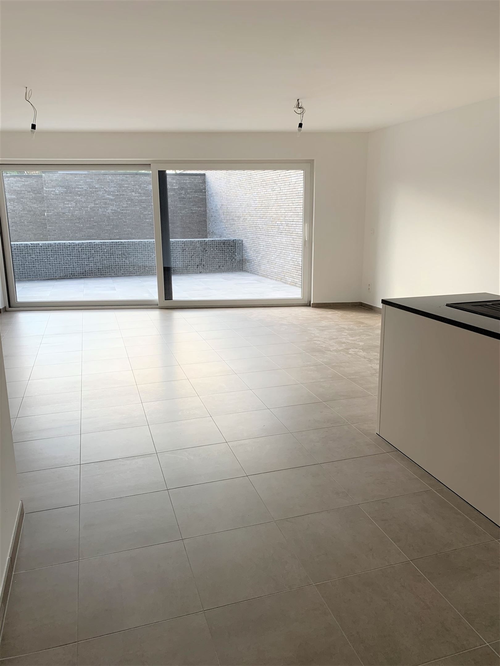 ongemeubeld gelijkvloers appartement foto 2