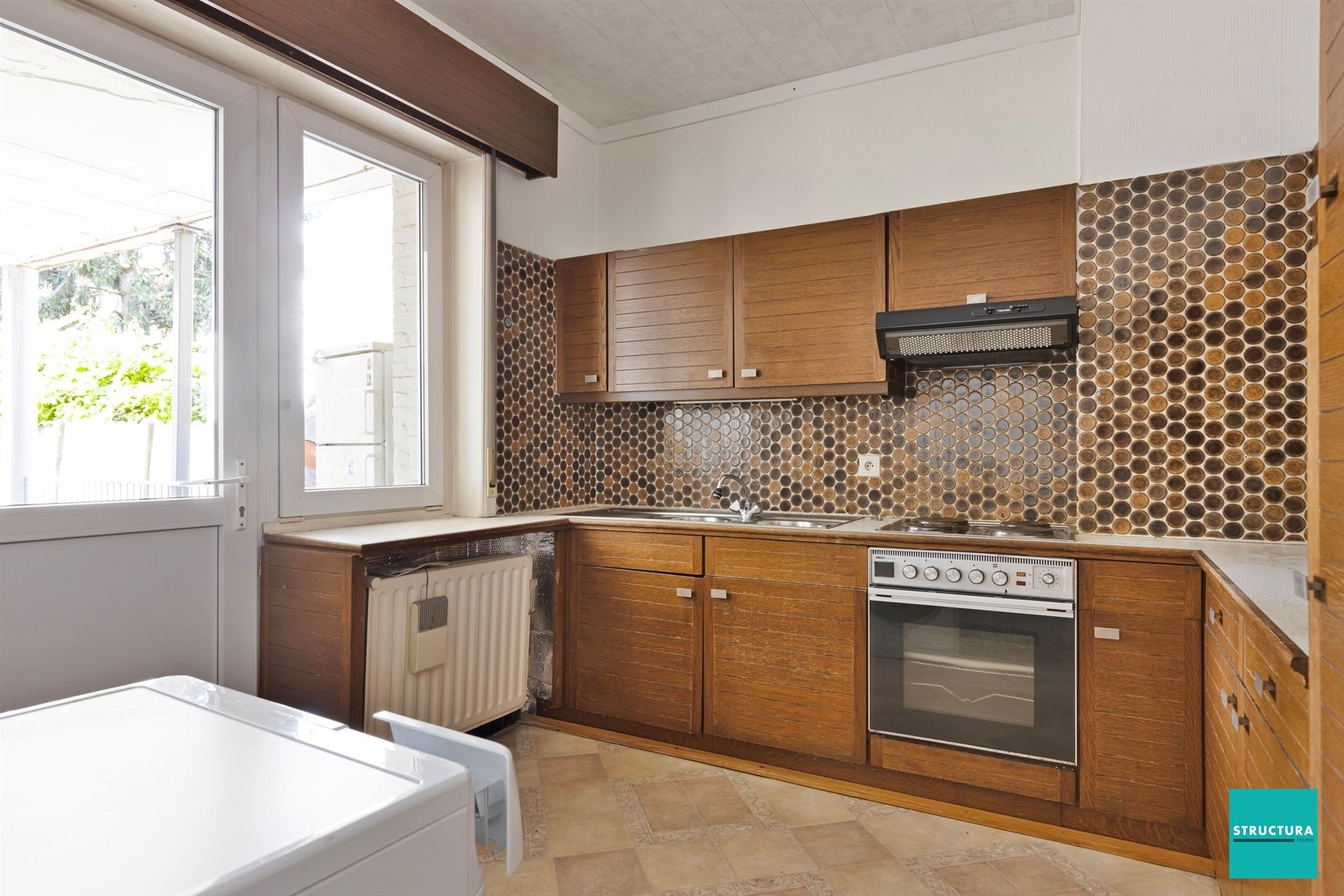 Opbrengsteigendom met 2 appartementen en 7 garageboxen foto 17