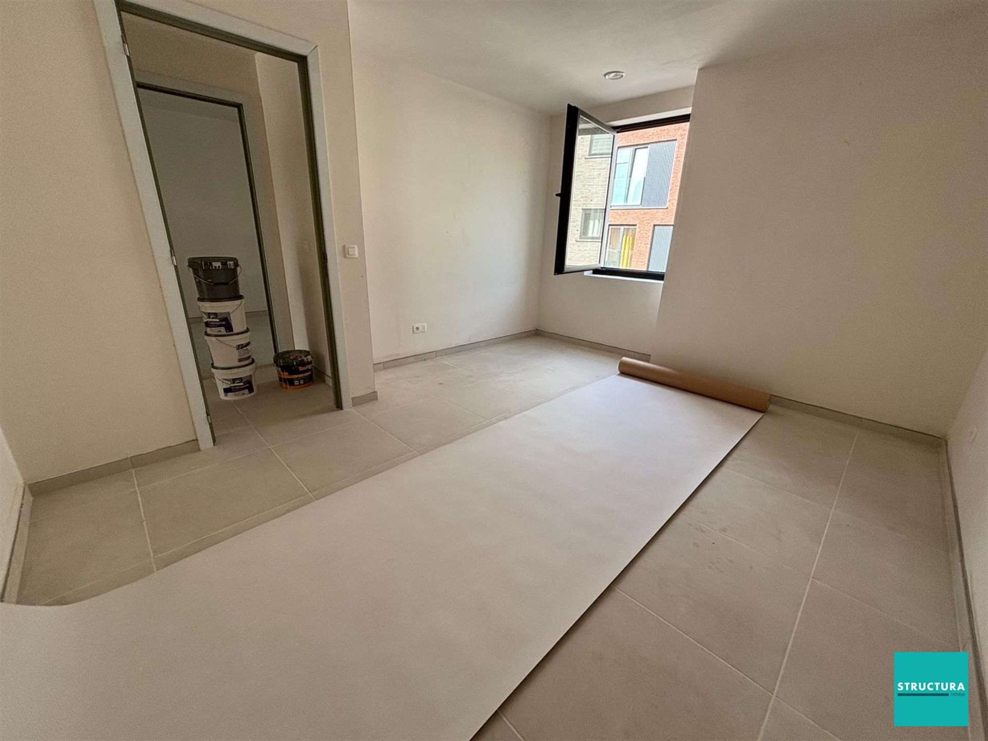Appartement met 2 slaapkamers en 2 staanplaatsen in centrum Merchtem foto 11