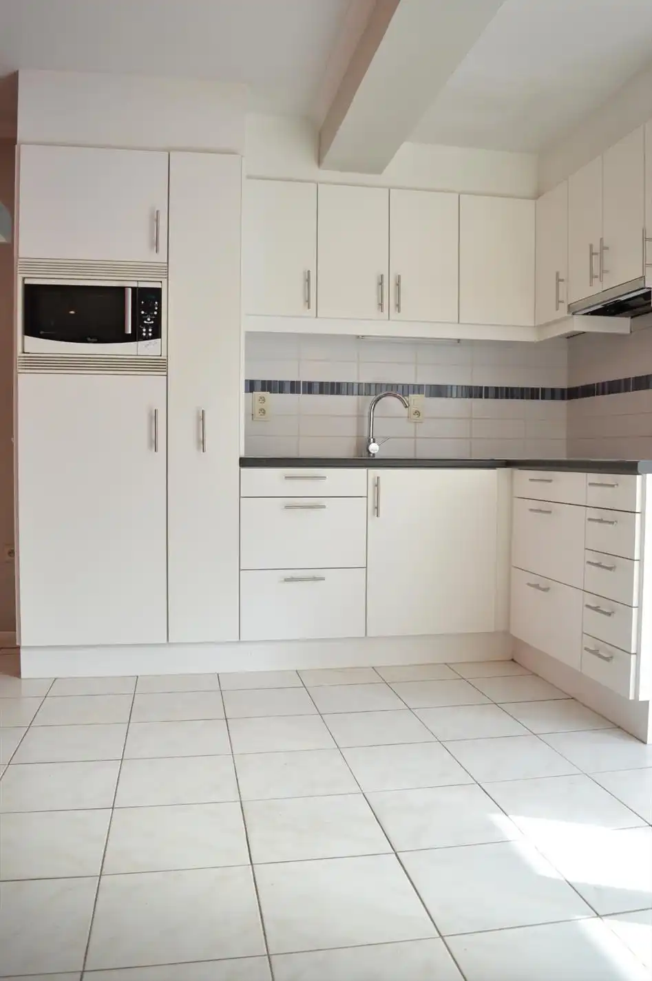 Verzorgde rijwoning dichtbij het centrum van Heule foto 6