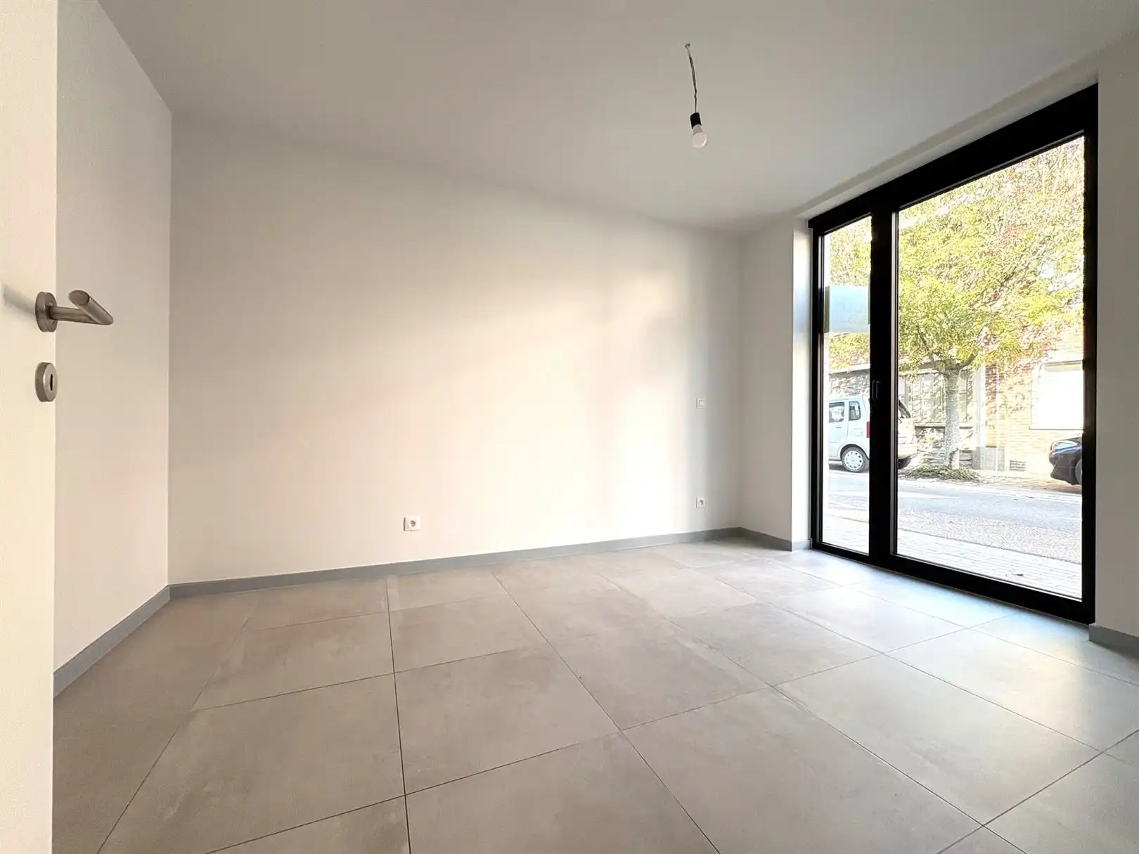 Modern en instapklaar gelijkvloers appartement met terras, tuin en ondergrondse staanplaats in Grembergen foto 11