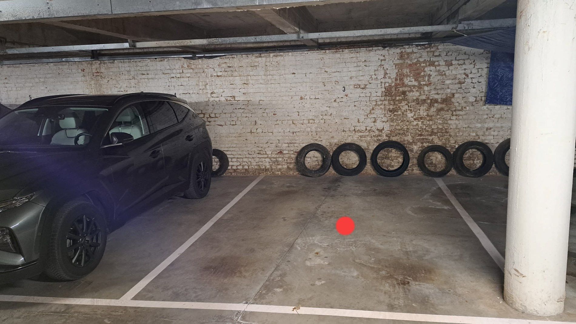 Zeer goed gelegen overdekte autostaanplaats in centrum Tienen foto 2