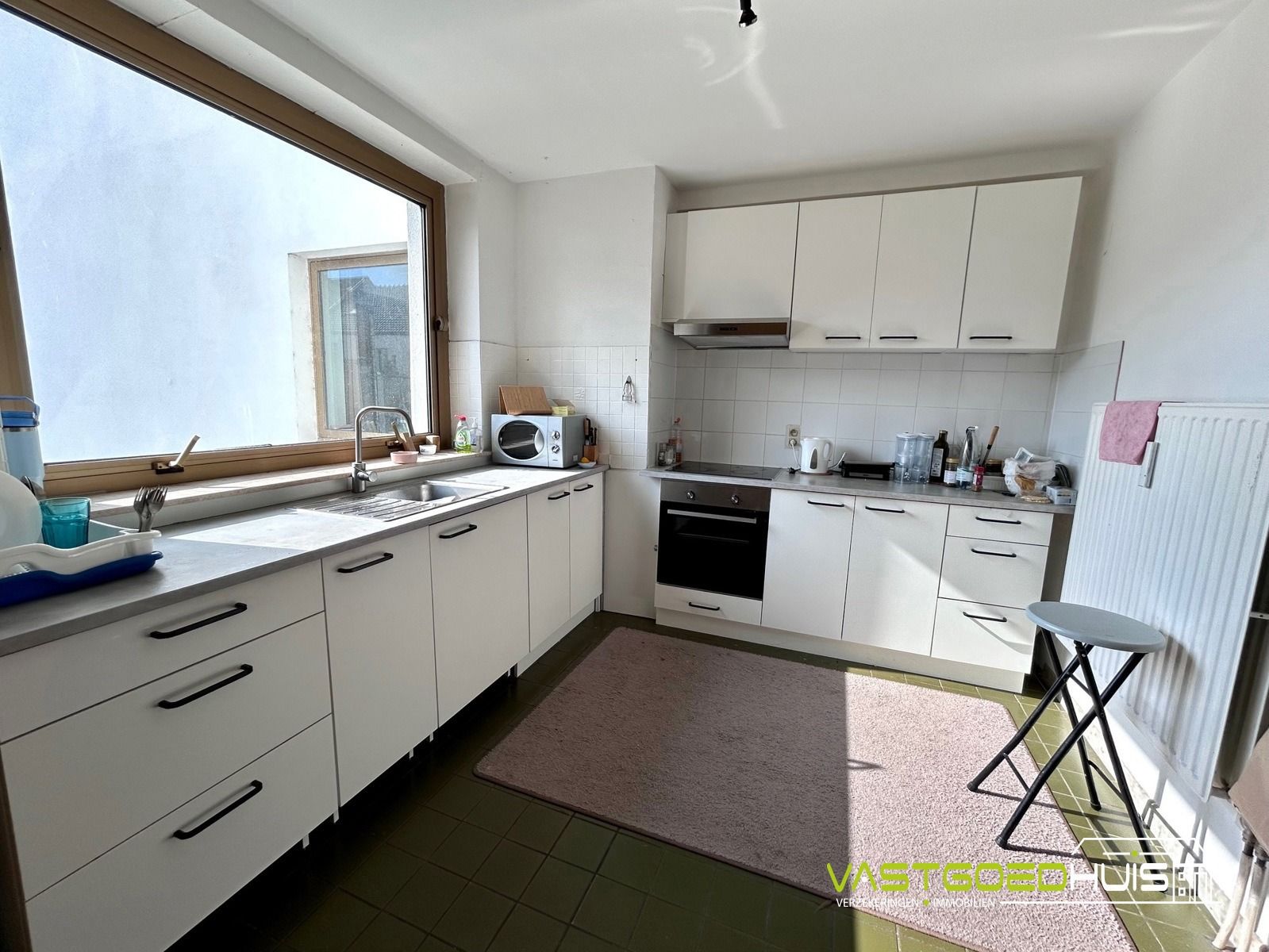 Ruim, gelijkvloers appartement met terras foto 10