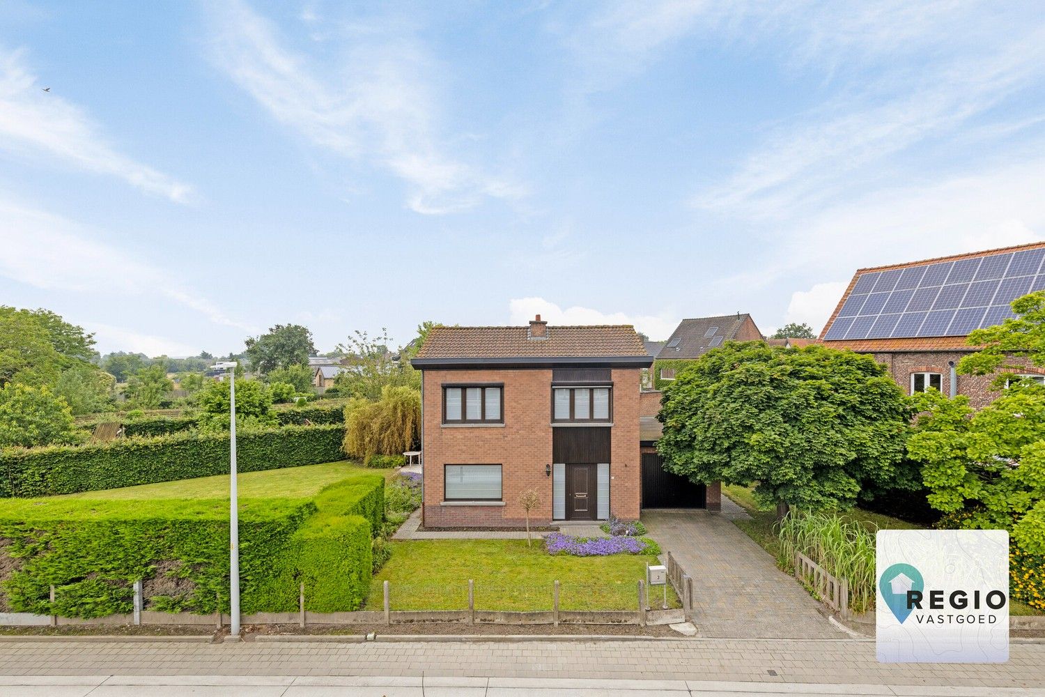 Kindvriendelijk gelegen open gezinswoning met ruime tuin te Hansbeke foto 1