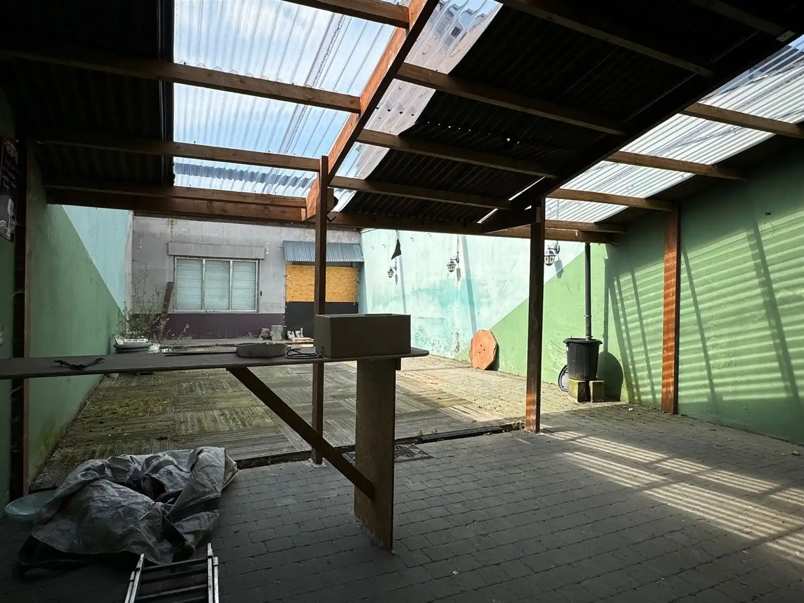 Polyvalent handelshuis met bovenwoonst aparte ingang en in 2 straten uitkomend. foto 25