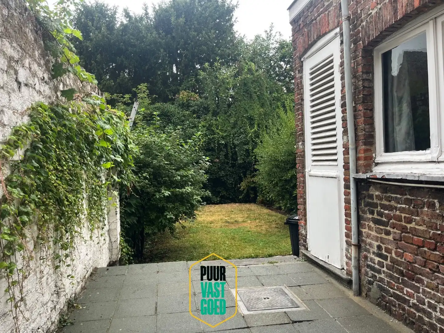 Op te knappen belle-époque woning met 'ziel' en een heel toffe tuin foto 19