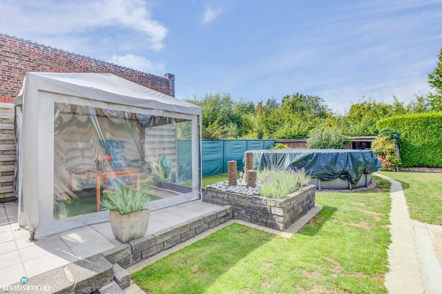 KARAKTERVOLLE EENGEZINSWONING MET 5 SLAAPKAMERS, GARAGE, CARPORT EN TUIN NABIJ HET CENTRUM VAN BILZEN foto 34