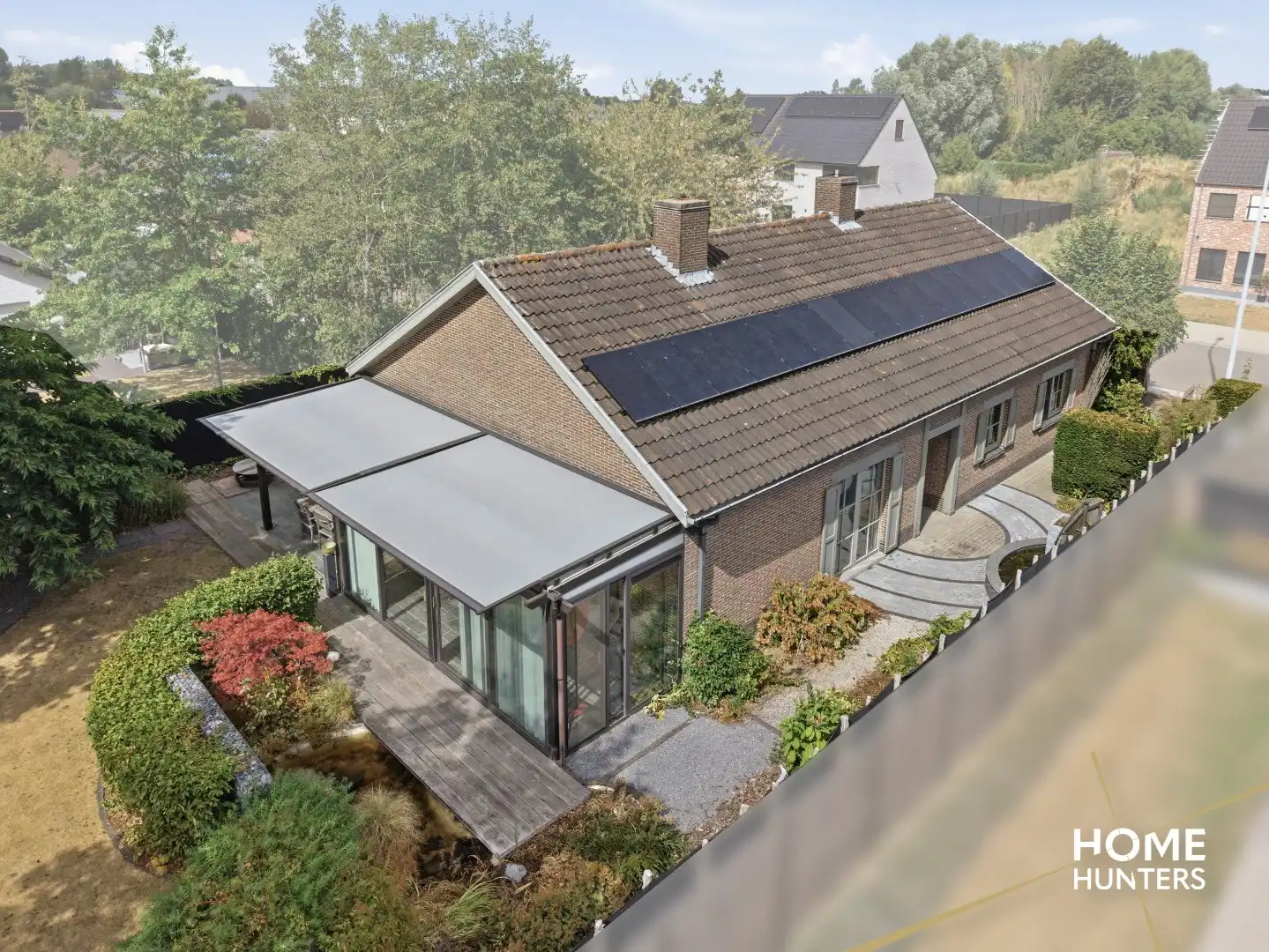 Alleenstaande woning met prachtige tuin en tal van extra troeven in een rustige wijk te Wervik foto 2