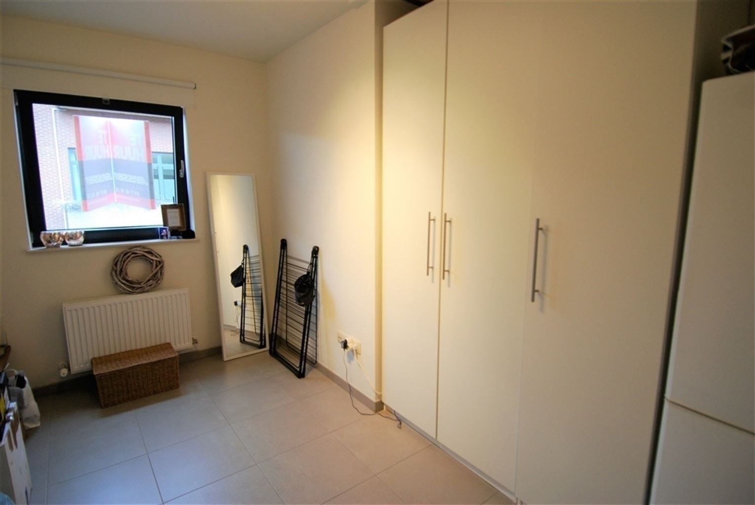 Gezellig appartement met 2 slaapkamers, 2 terassen, autostaanplaats en kelderberging in het centrum van Maaseik. foto 9