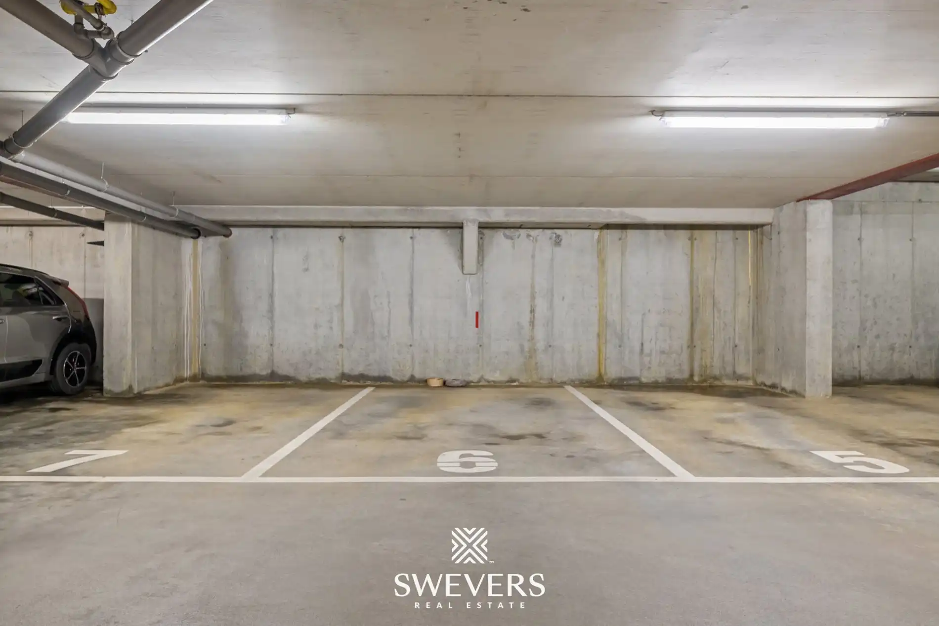 Ruim gelijkvloers appartement met tuin en ondergrondse autostaanplaats foto 22