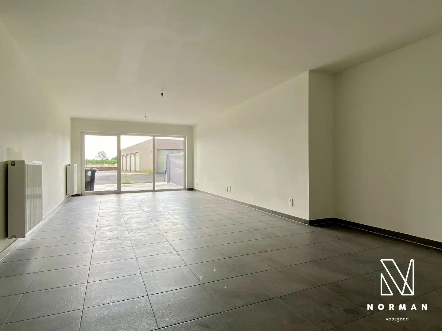 Gerenoveerd gelijkvloers appartement met 2 slaapkamers en inpandige garage en zonneterras! foto 9