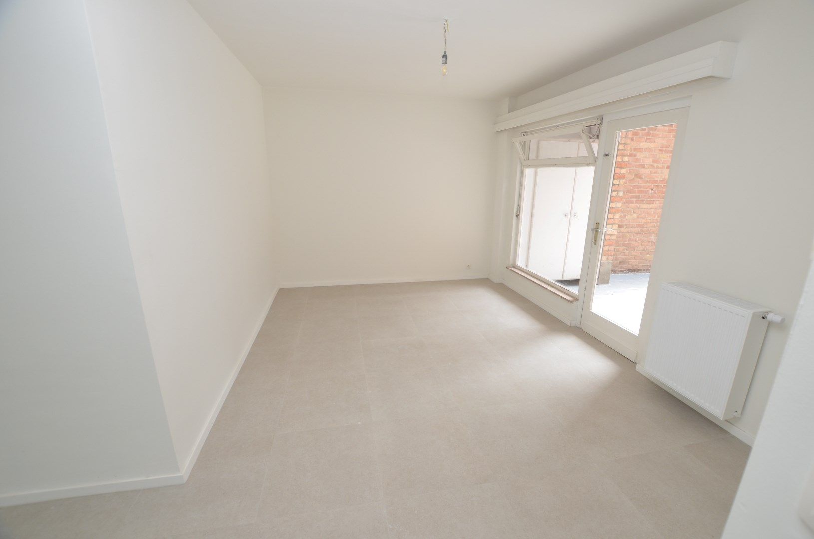 IN OPTIE !!!! Goed gelegen appartement met grote koer foto 3