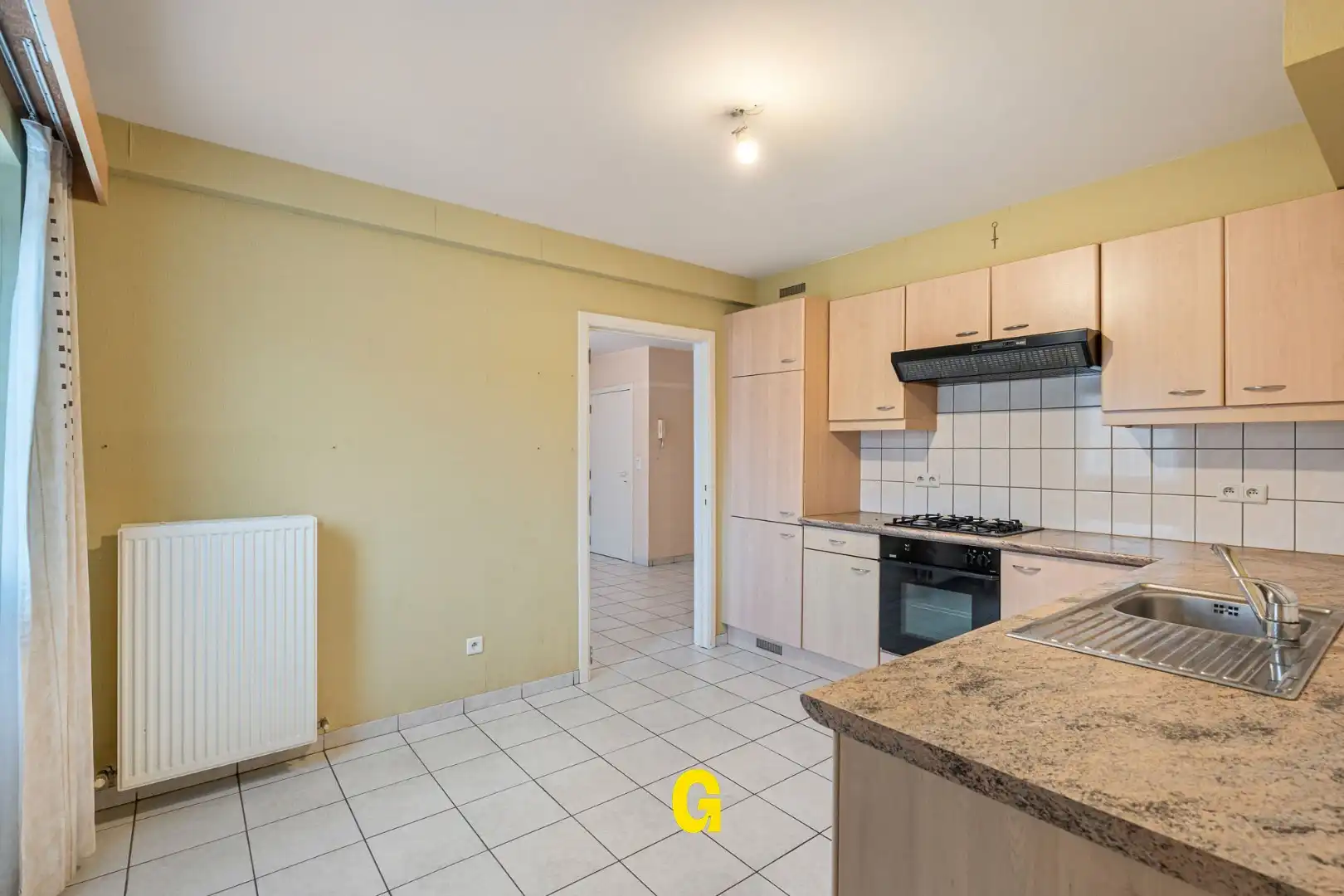 Degelijk (rolstoelvriendelijk) gelijkvoersappartement met terras uitgevend op de tuin, afsluitbare garage en berging foto 12