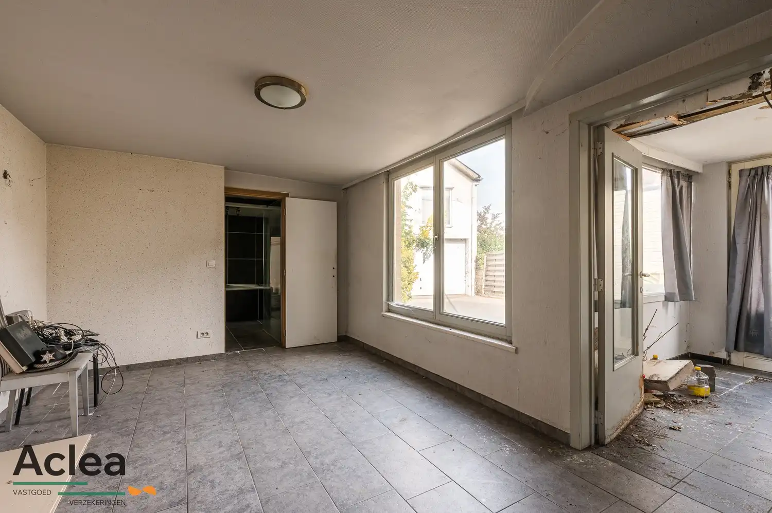 Te renoveren woning met grote magazijnruimte en veel potentieel foto 16