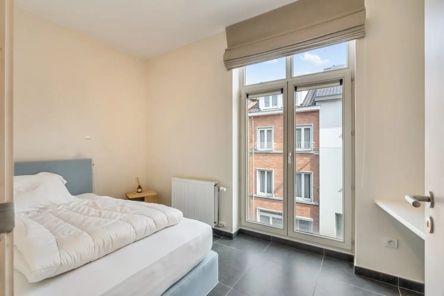 Goed gelegen en lichtrijk appartement met 2 slaapkamers, een terras en een autostaanplaats te centrum Leuven! foto 15