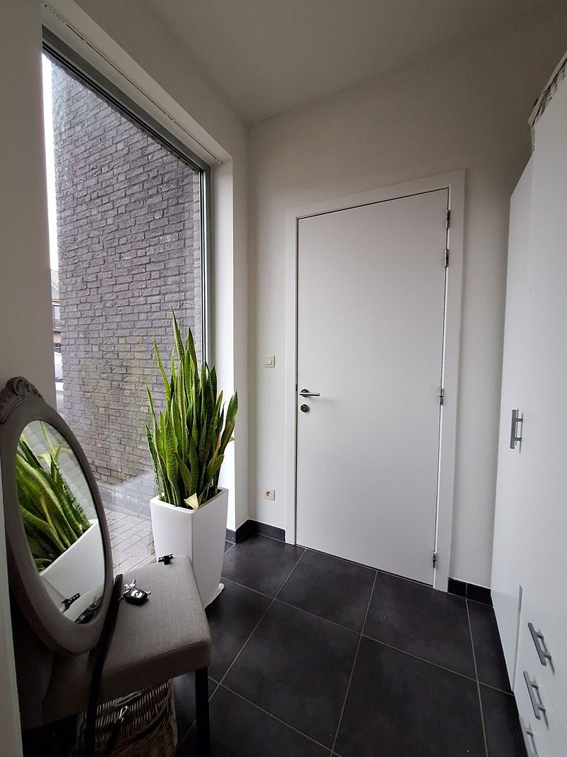 Knus gelijkvloers appartement met leuk zonneterras en tuintje foto 2