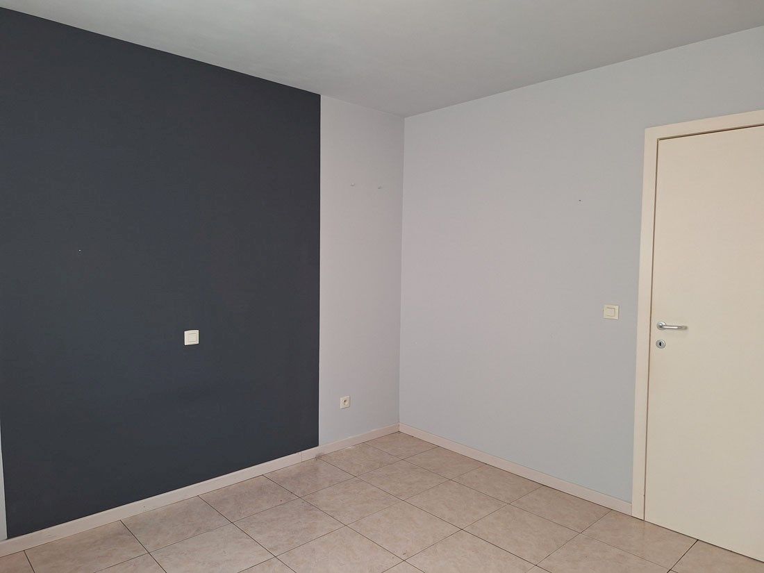 Stijlvol gelijkvloers appartement met terras en autostandplaats foto 11