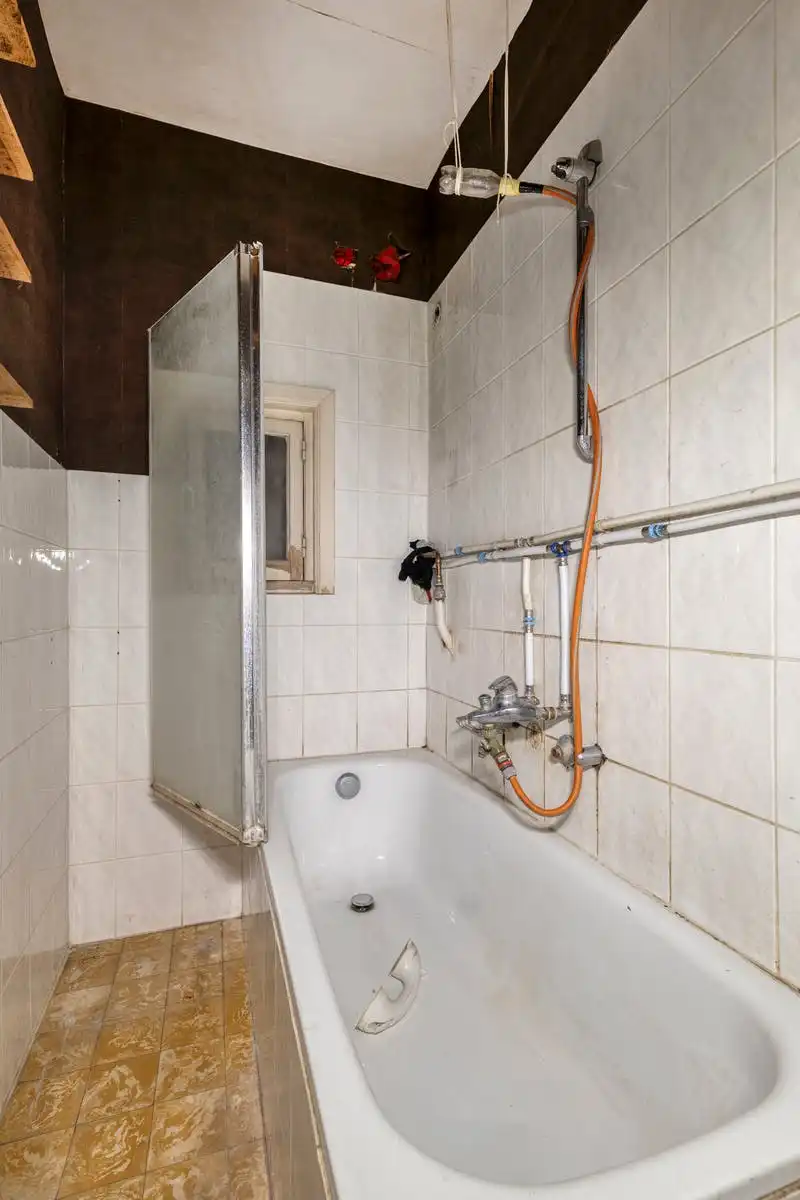 Opbrengsteigendom met renovatiepotentieel op toplocatie in Kortrijk foto 15