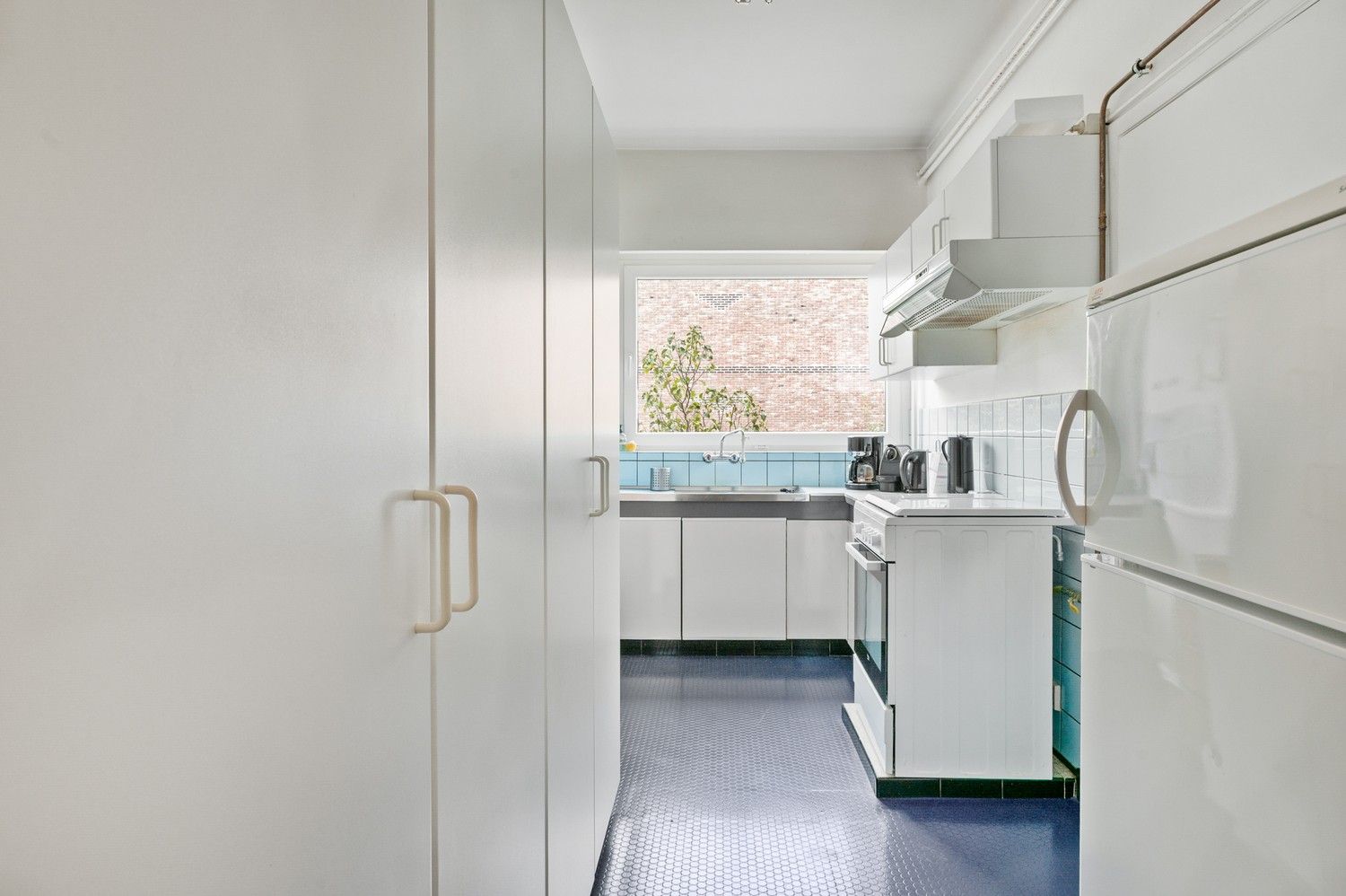 Groot 2 slaapkamer appartement met terras in een doodlopende straat in het centrum van Wijnegem! foto 7