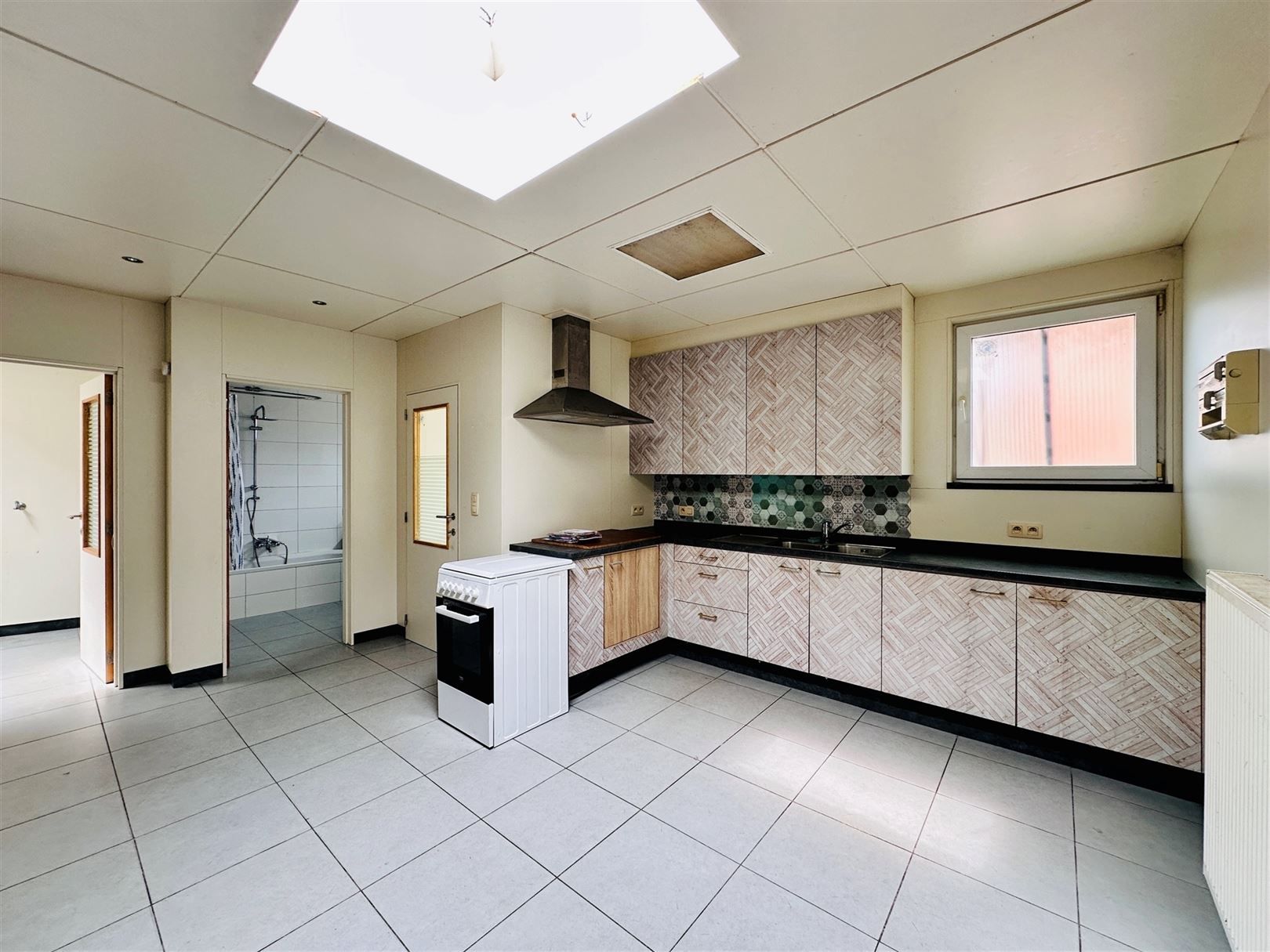 Ruime woning met diepe tuin in Grembergen met mogelijkheid tot handel of zelfstandige activiteit foto 8