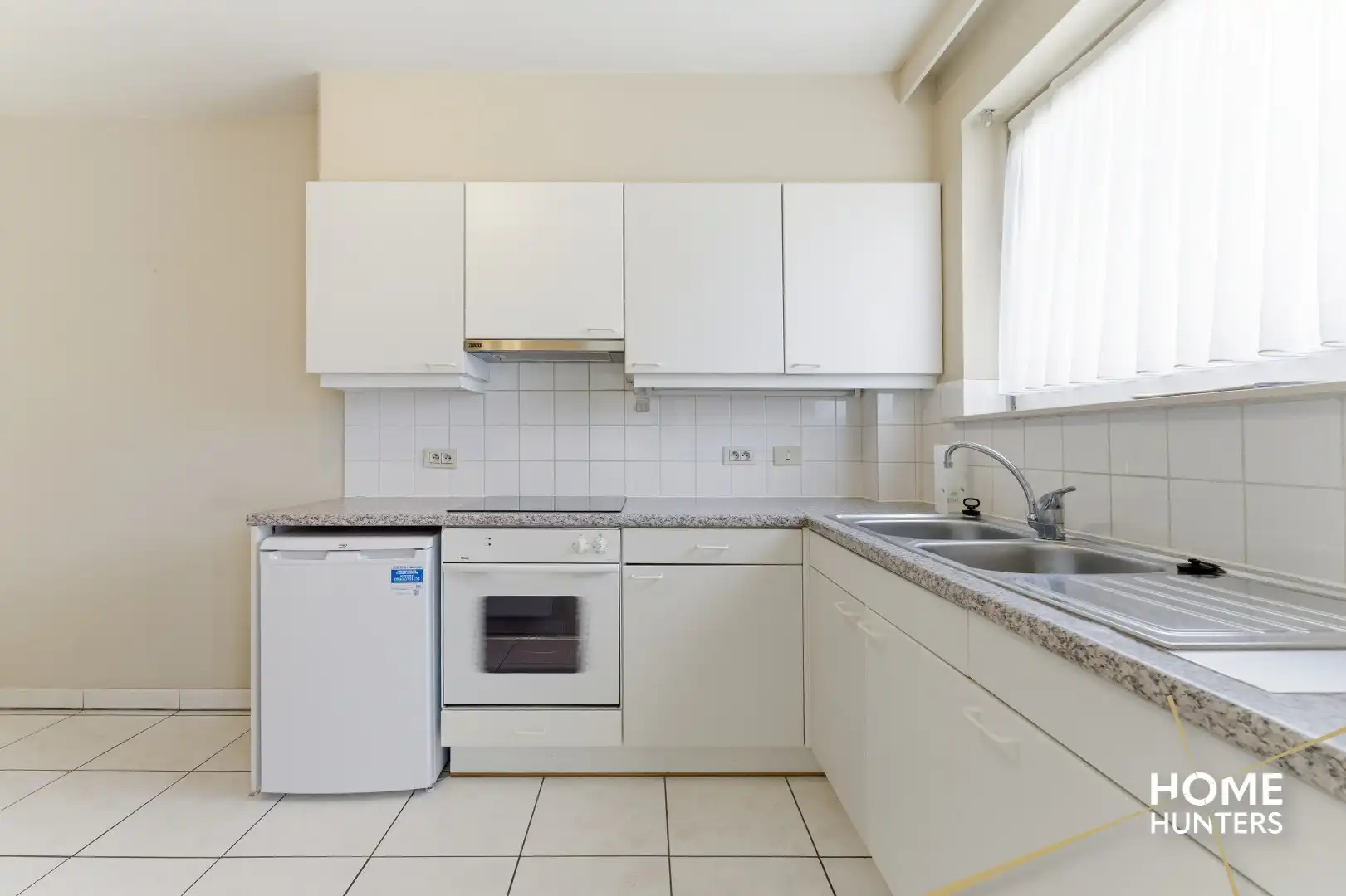 Instapklaar gelijkvloers appartement met 2 slaapkamers en ruime tuin foto 11