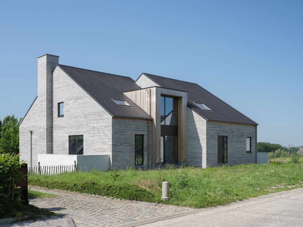 Architecturale casco-nieuwbouw bestaande uit een uitzonderlijke stapelwoning met onderliggende garage en adembenemende zichten over de Scheldevallei. foto {{pictureIndex}}