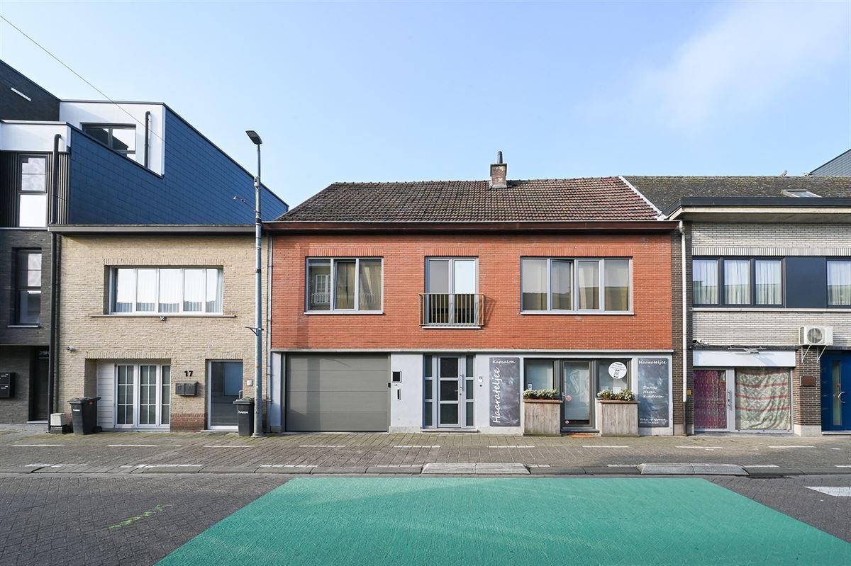 Ruime woning met zéér grote garage en leuke tuin foto 2