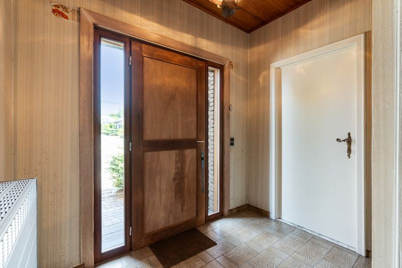 Gelijkvloerse woning met grote loods achteraan op 25are foto 5