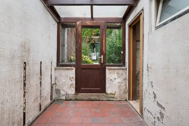 Te renoveren starterswoning met 2/3 slaapkamers en tuinjte foto 10