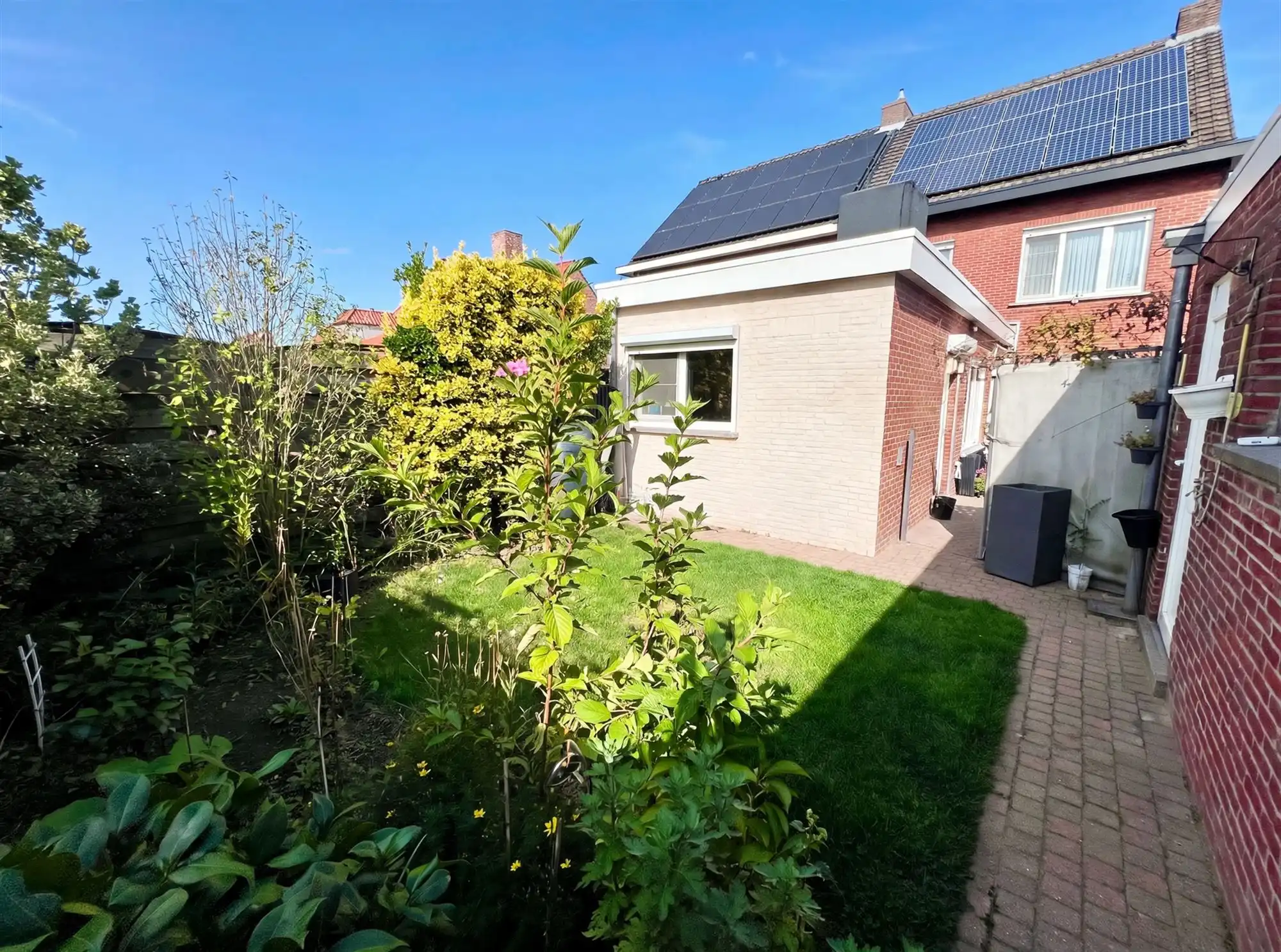 Degelijke halve losbouw met 4 slpks, (voor)tuin en garage foto 27