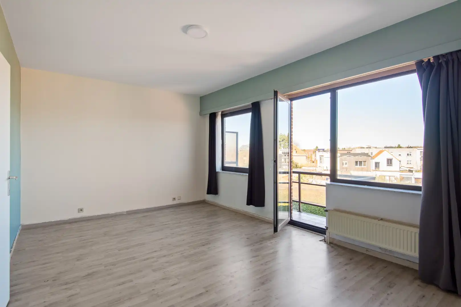 Ruim en lichtrijk 2-slaapkamerappartement in hartje Wijnegem foto 12