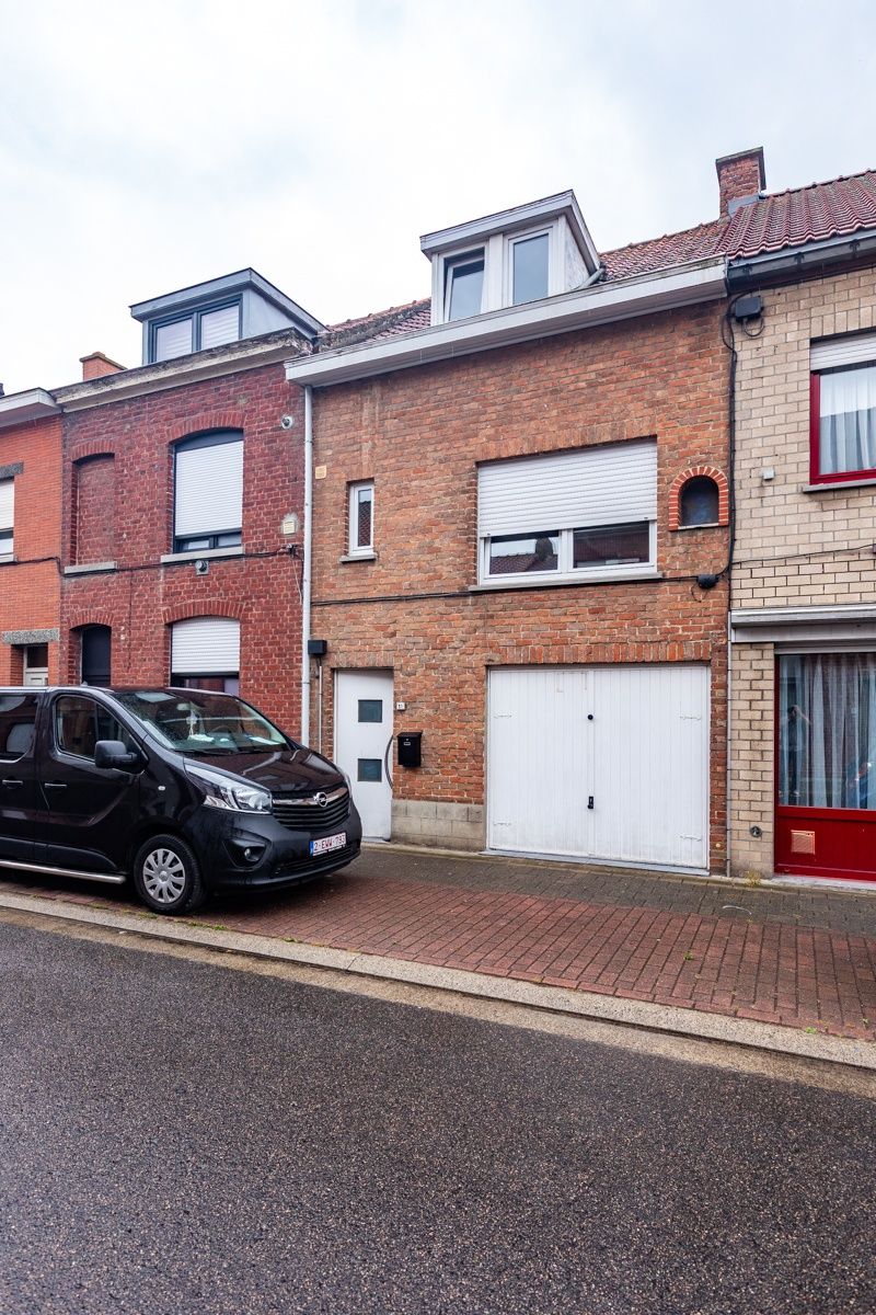 Woning met 2 slaapkamers, tuin, garage en garage- uitweg achteraan (extra parkeerplaats). Energielabel D (bijna C) foto 11