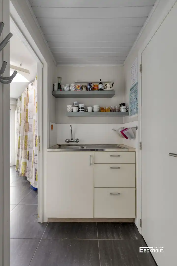Instapklare woning met handelsruimte en met zonnige tuin! foto 21