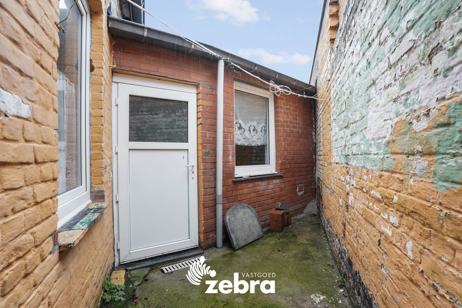 Deels gerenoveerde woning met twee slaapkamers te centrum Tielt! foto 12