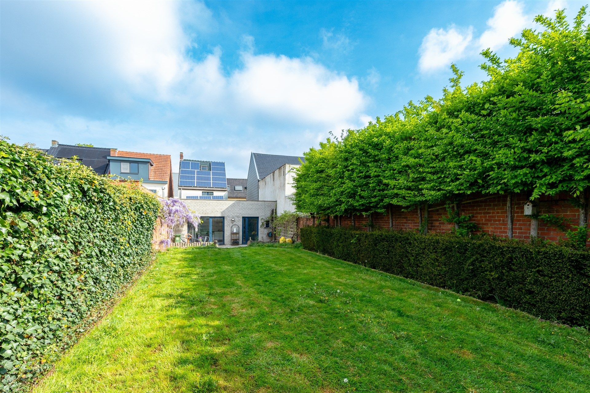 Bijzonder ruime woning met diepe tuin in Wetteren centrum foto 22