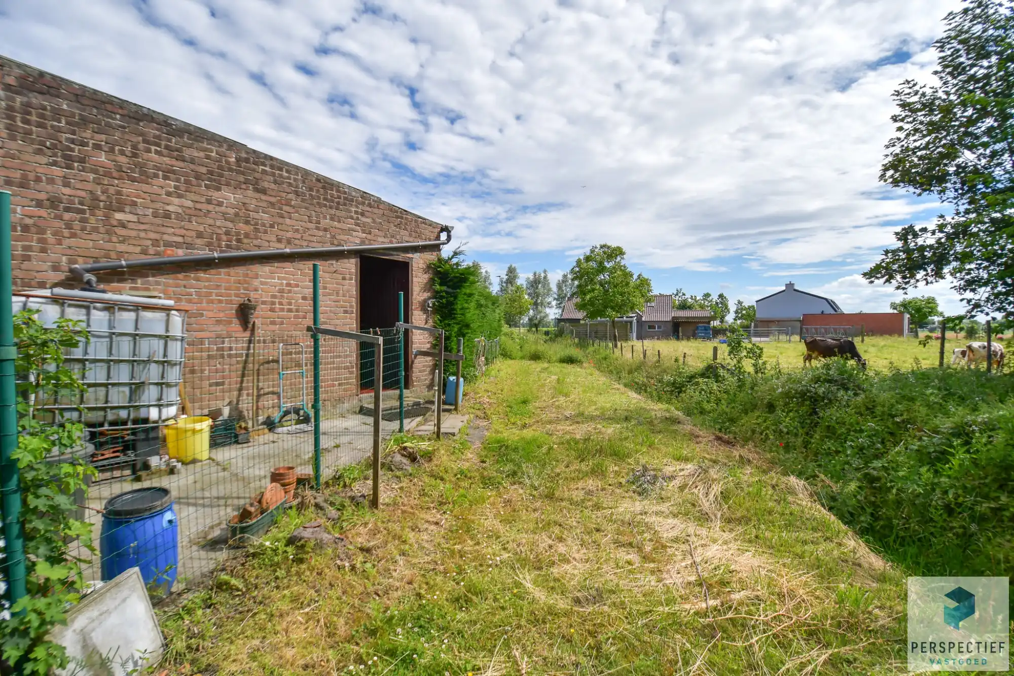 Rustig gelegen vrijstaande woning met garage, ruime tuin en prachtig open zicht foto 14