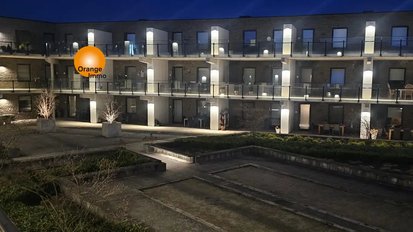 Ruim nieuwbouwappartement in het commercieel centrum van Eisden. foto {{pictureIndex}}