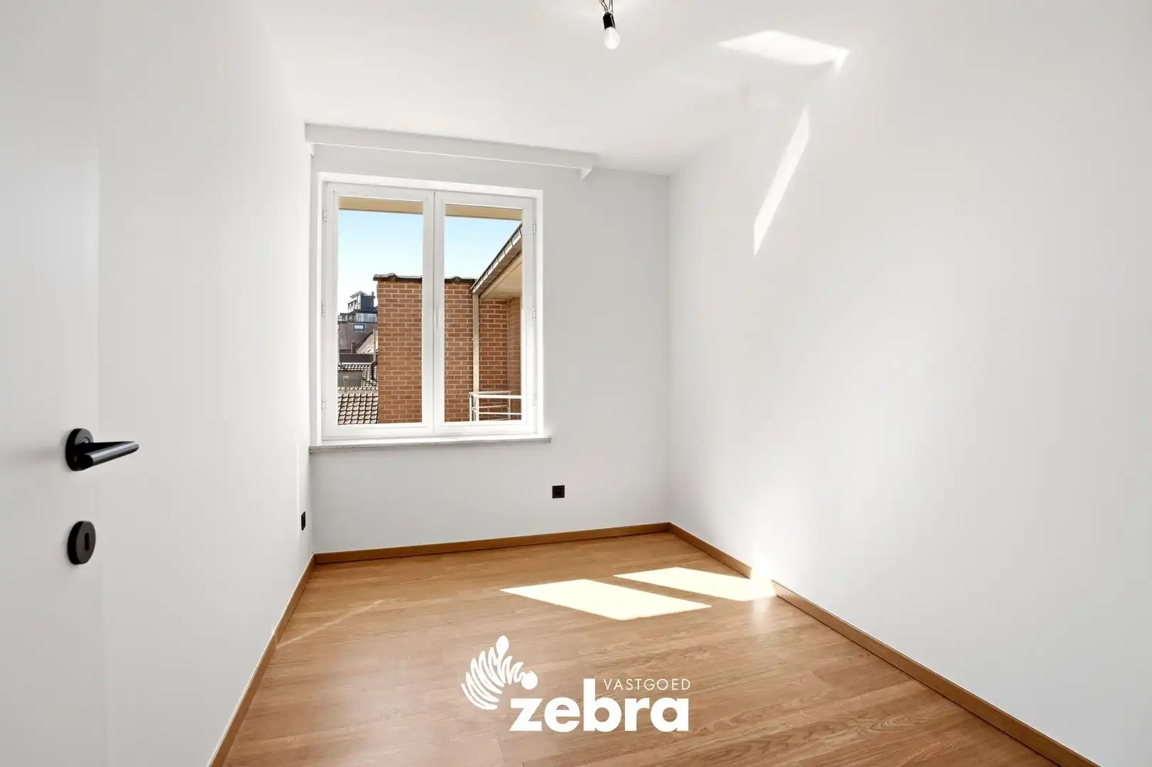 Zeer ruim appartement (137 m²) te koop met dubbele garage in het hartje van Tielt! foto 17