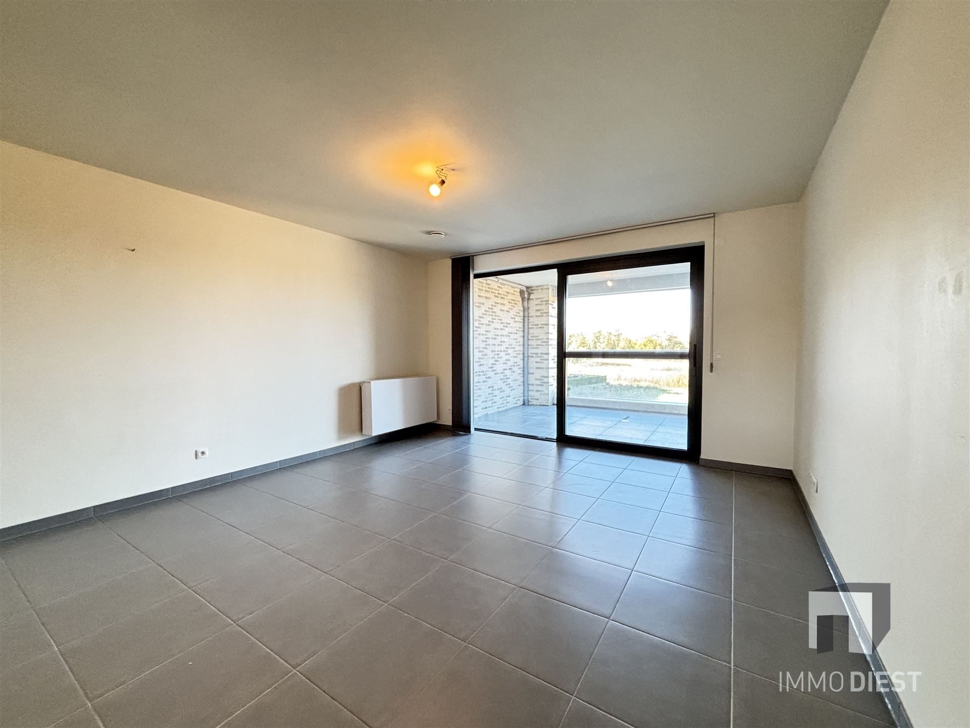 Ruim appartement op de tweede verdieping in het centrum van Tessenderlo foto 8