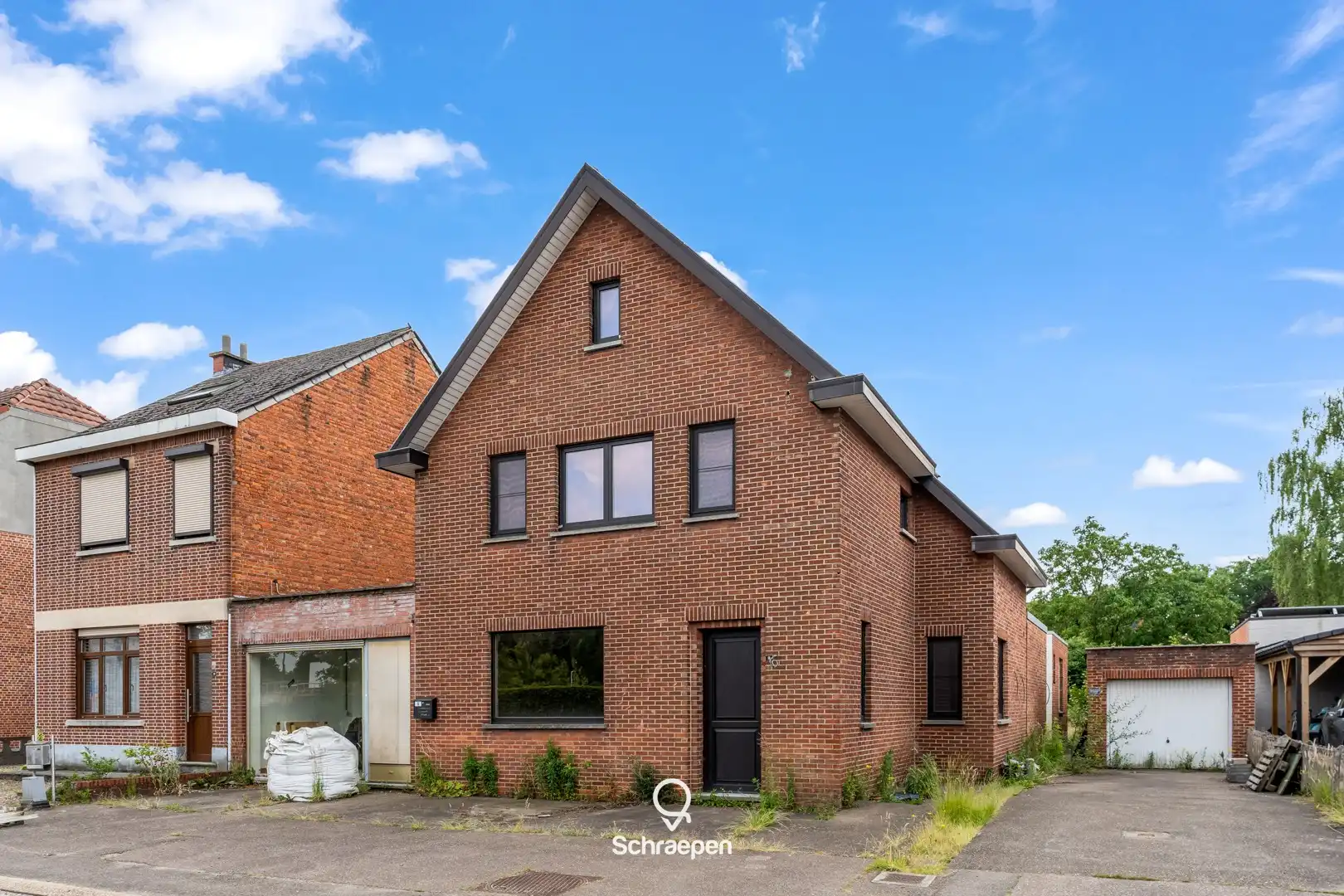 Hoofdfoto van de publicatie: Gezinswoning met handelsruimte op zuidelijk georiënteerd perceel van 7,5 are te Kiewit!