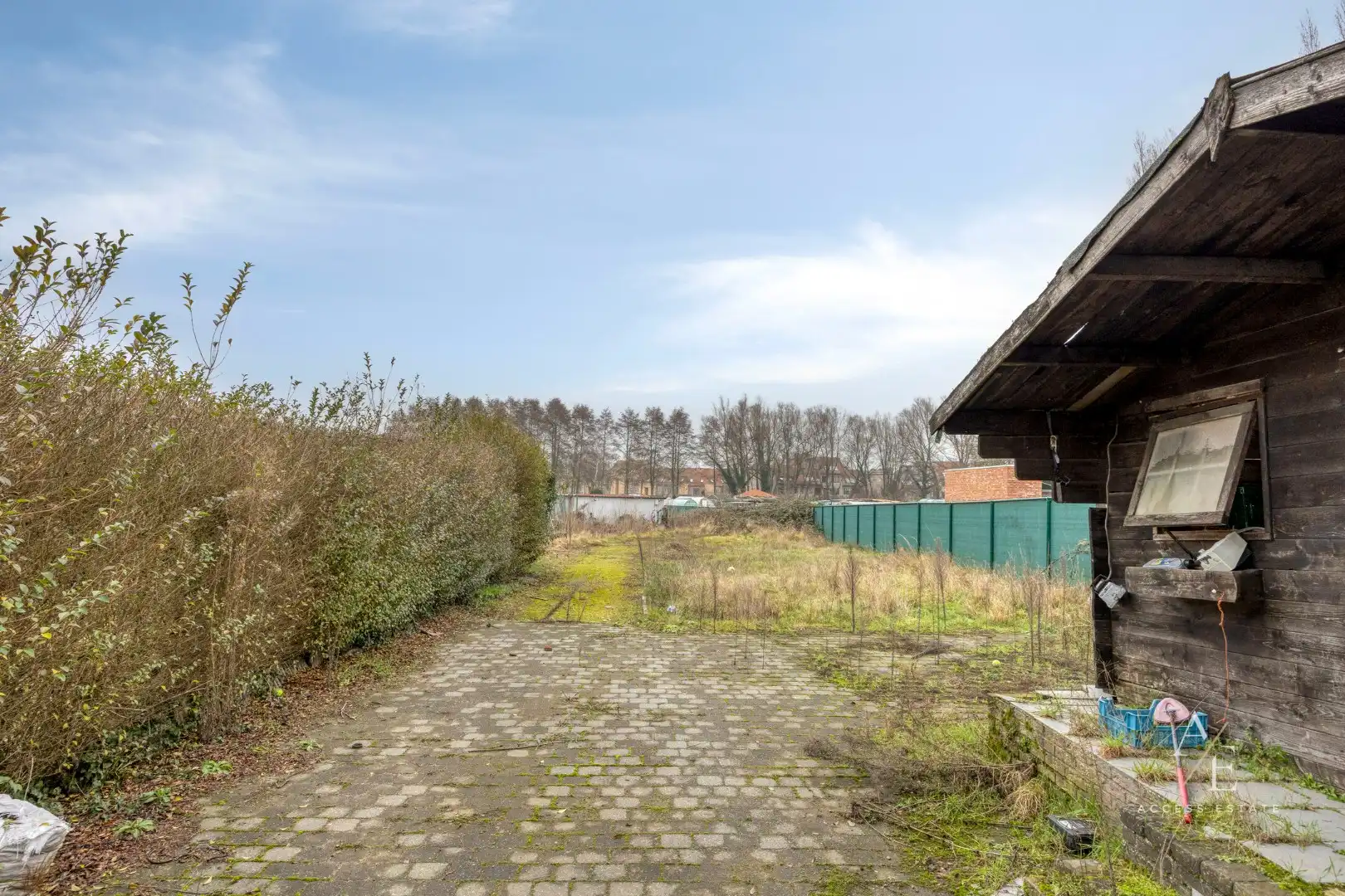 Veelzijdig te renoveren eigendom met tuin en 2 garages en achterdoorgang in Temse foto 2