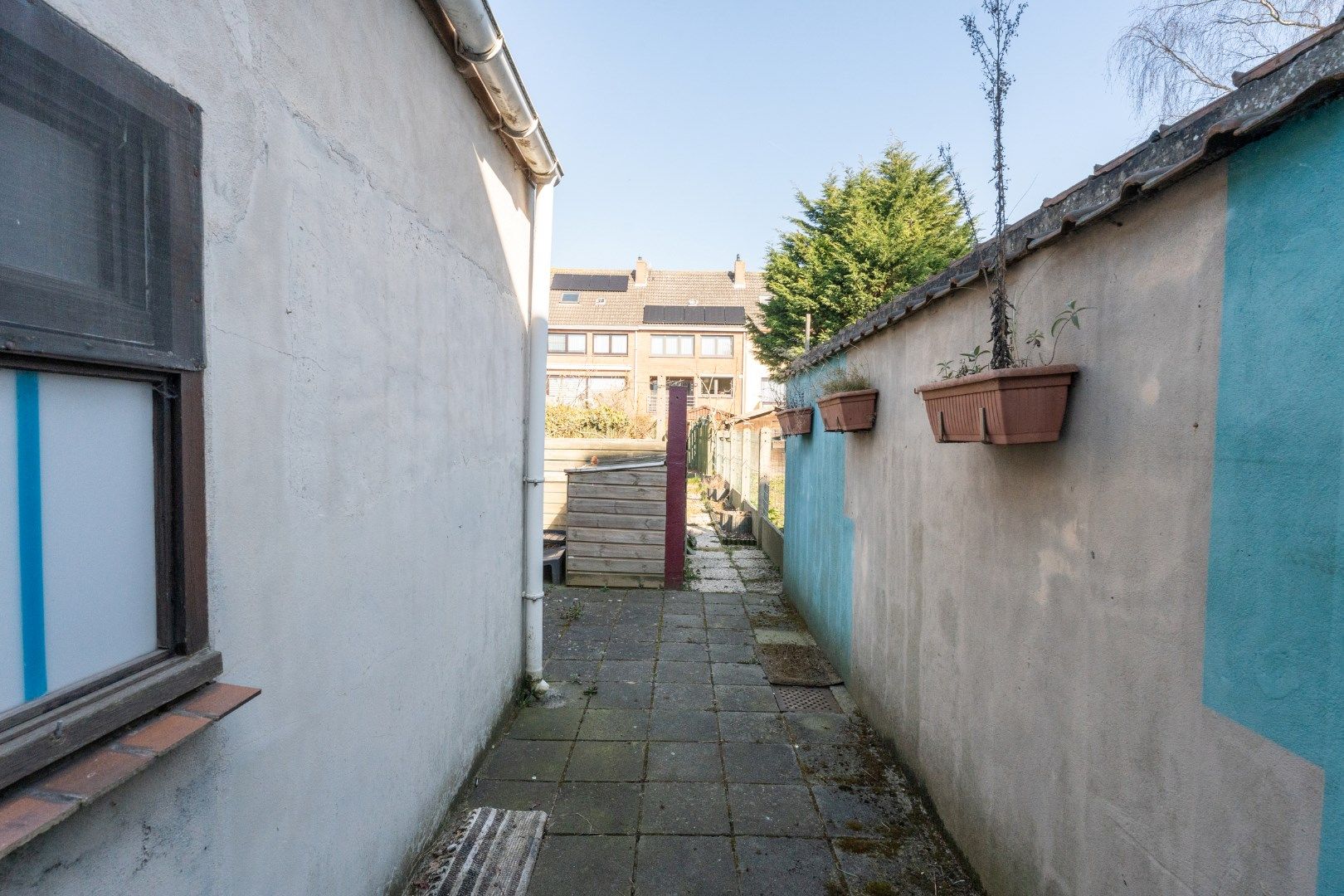 Volledig te renoveren stadswoning met zonnige tuin en tal van mogelijkheden op strategische ligging! foto 10