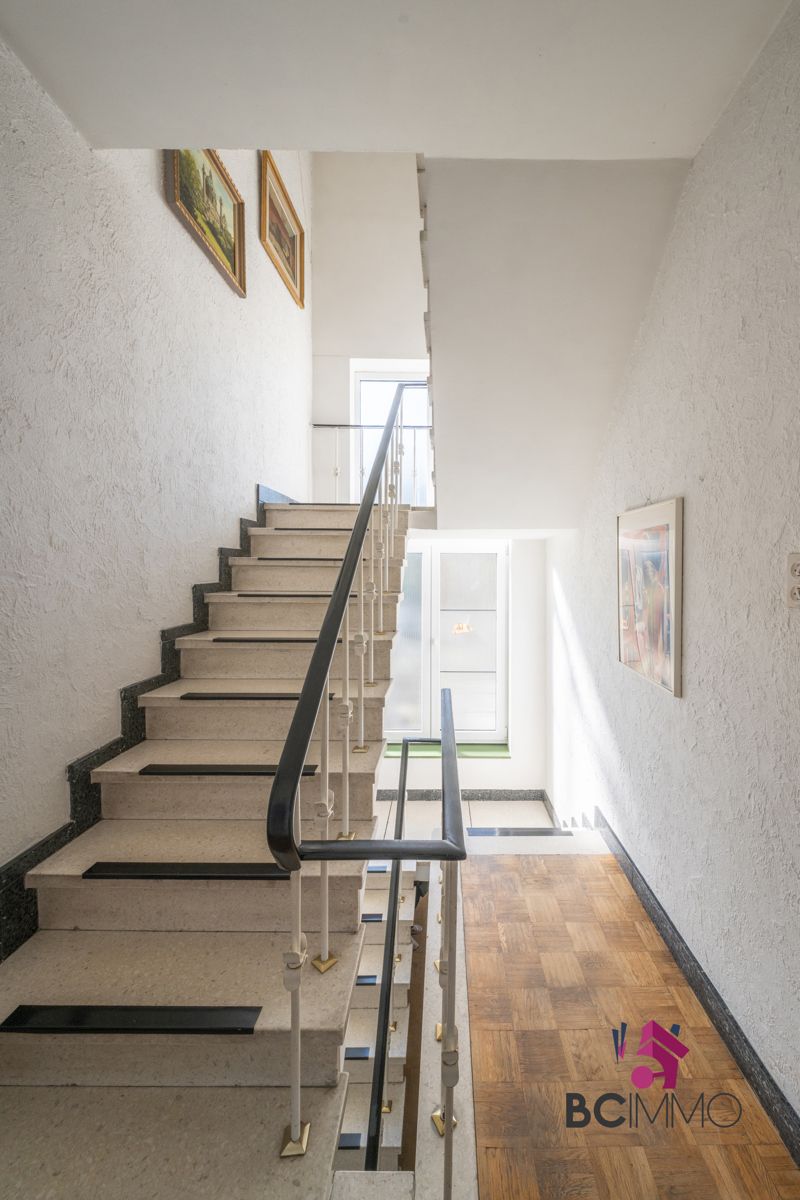 Ruime woning met praktijkruimte en 6 slaapkamers te Genk foto 25