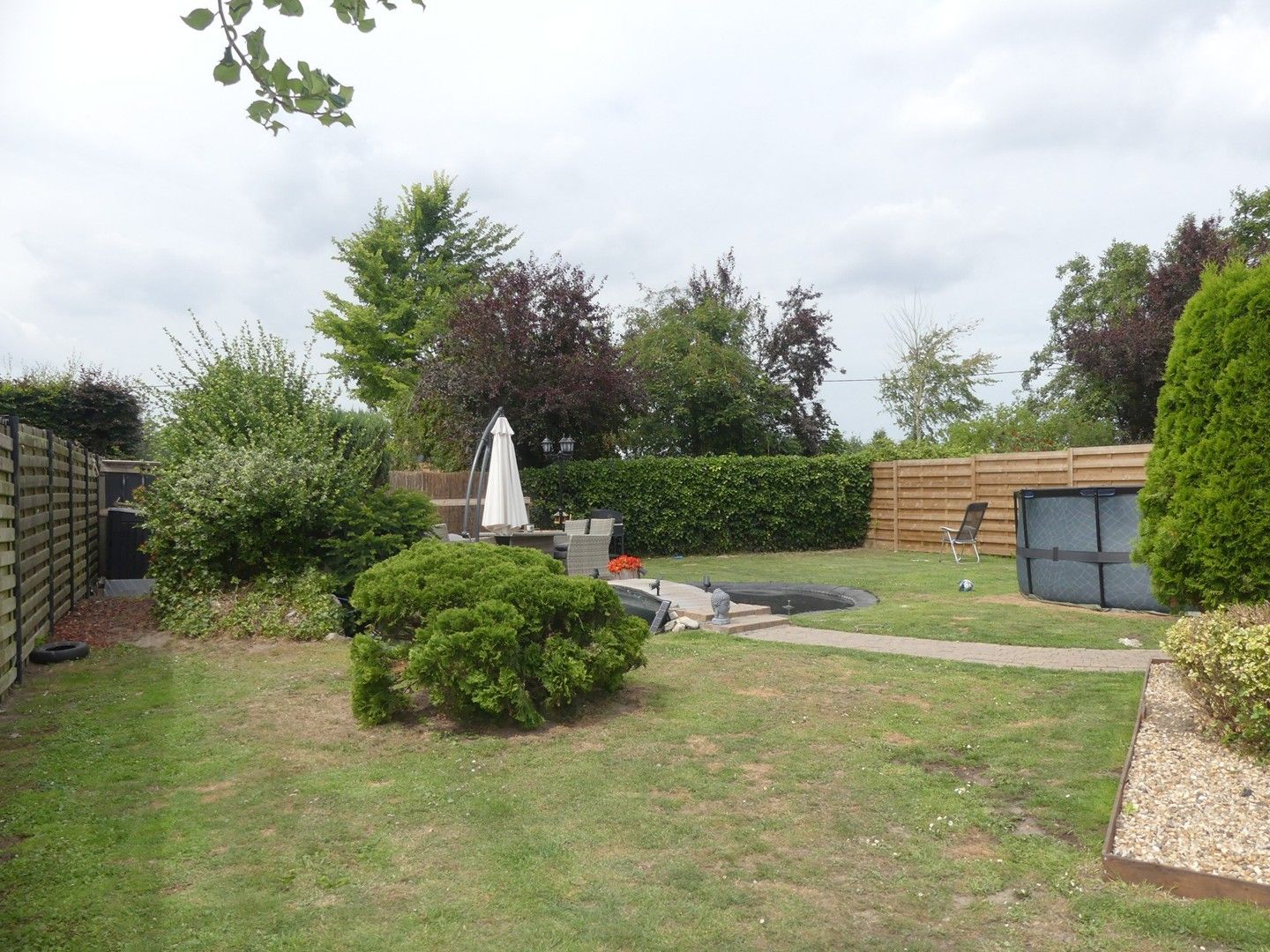 Alleenstaande woning met terras, zongerichte tuin en garage foto 15