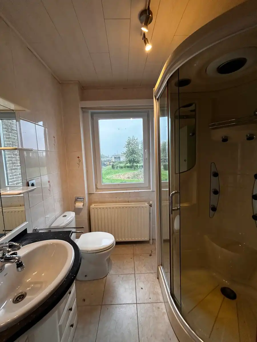 Ruime woning met 5 slpk, 2 badkamers, garage en ruime tuin foto 13